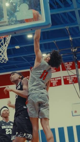 Expressions player finishing a dunk in transition